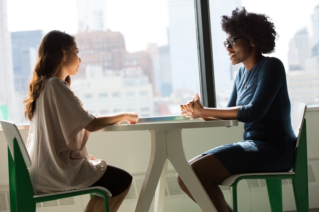 Counselor speaking with an adult client during a therapy session