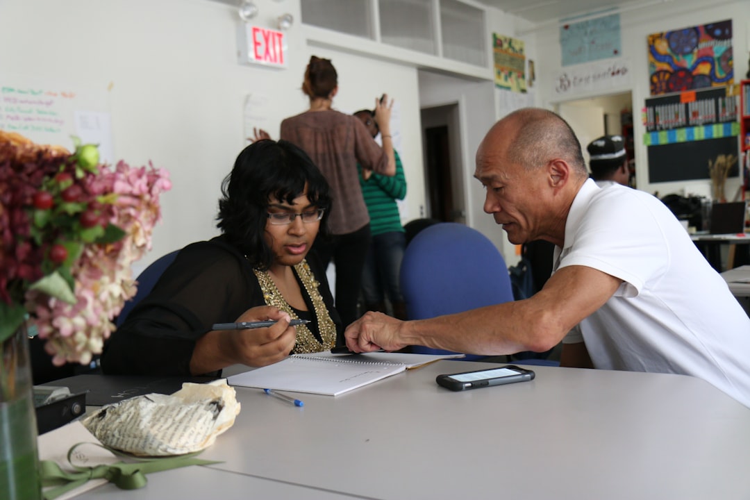 Support professional helping a person complete community service paperwork