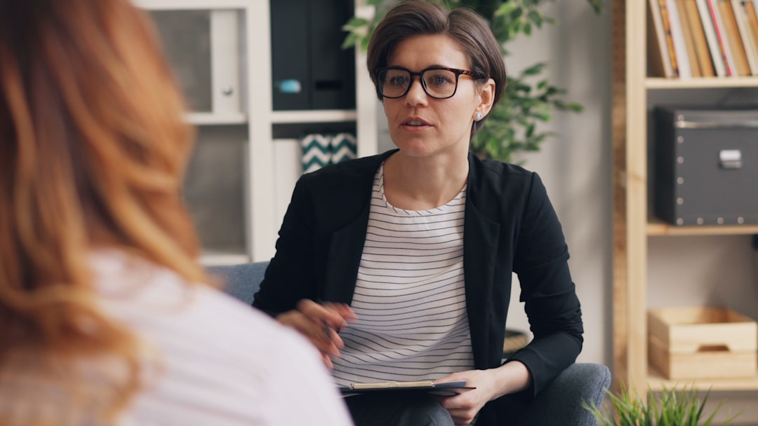 Counselor meeting with an adult client to discuss a treatment plan
