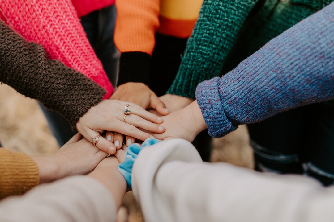 Hands joined together to represent coordinated community support
