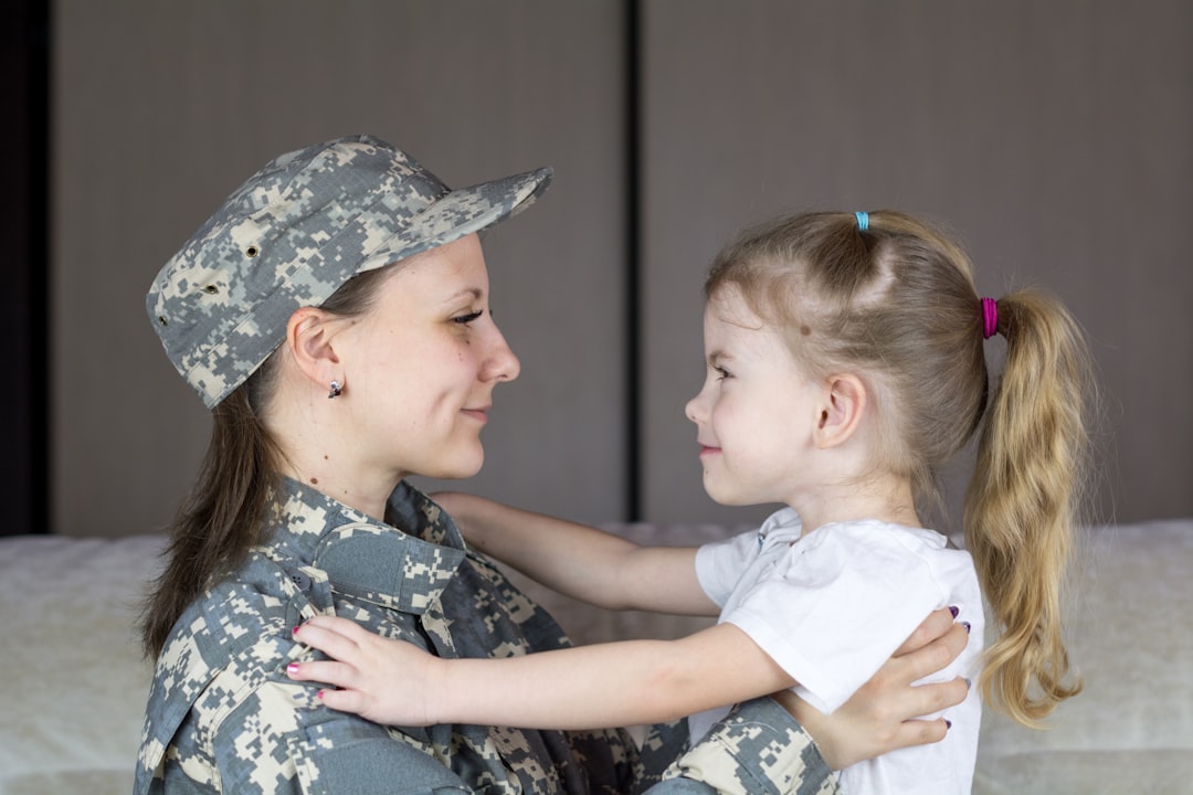 Military parent embracing a child